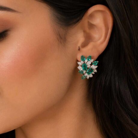 floral-inspired emerald and diamond cluster